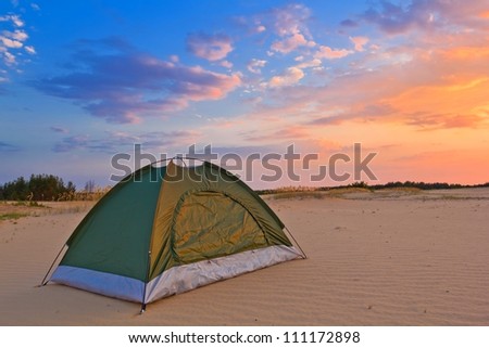 small touristic tent in a desert at the evening