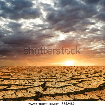 dry cracking earth on a sunset