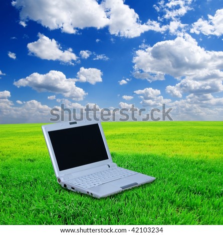 notebook on a green grass