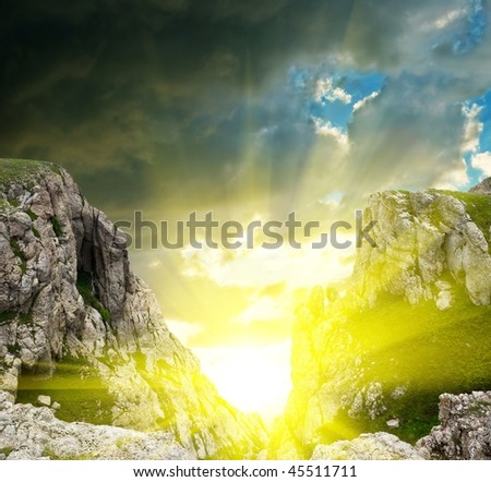 sparkle sun in a mountain crack