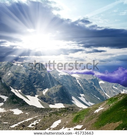sparkle sun above a mountain chains
