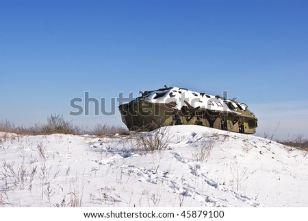 old war vehicle in a snowbound plain