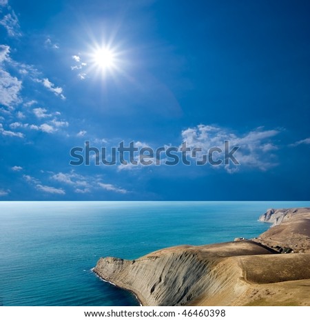 sparkle sun above a sea cape