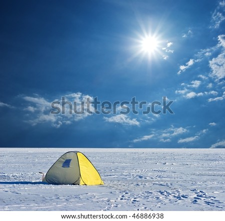touristic tent in a winter plain