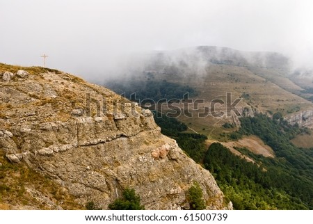 mountain precipice in a fog