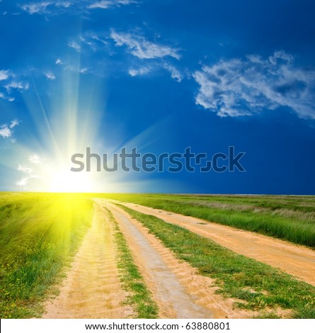 beautiful road in a steppe to a sparkle sun