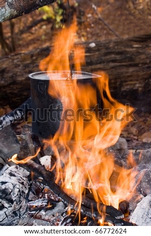 black touristic cauldron in a fire