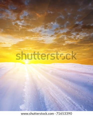sunset in a winter plain