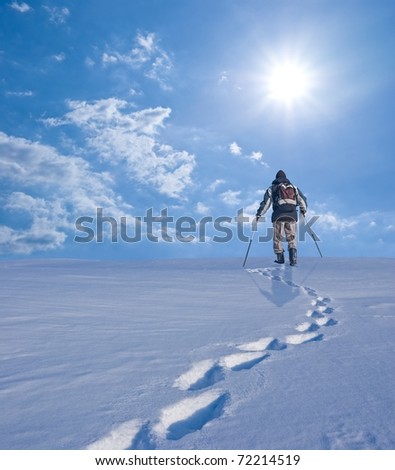 hiker in a winter plain