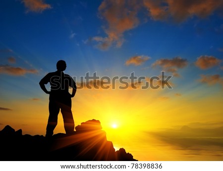 man stay on a marine cape at the sunset