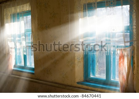 rays of sun pushing through a room window