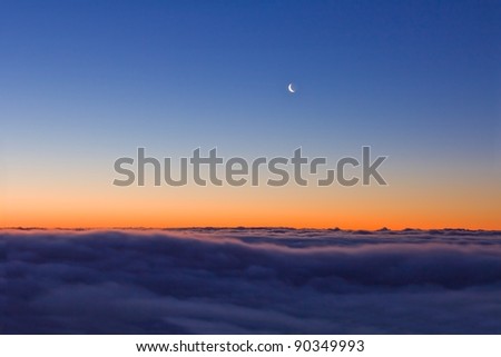 quiet evening scene moon on a dusk sky