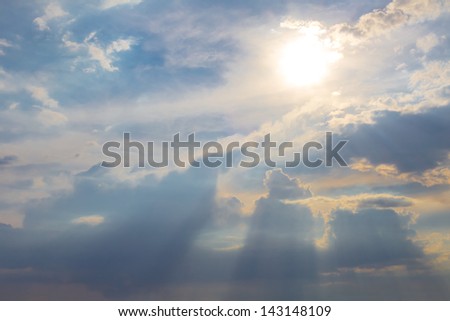 sun rays pushing through a clouds