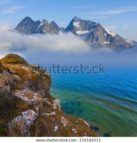 mountains beyond a sea