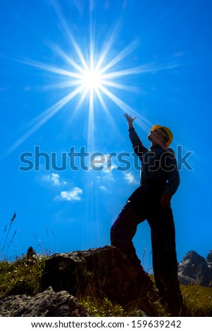 man silhouette under a sparkle sun