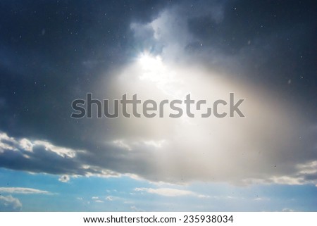 sun pushing through a dense clouds