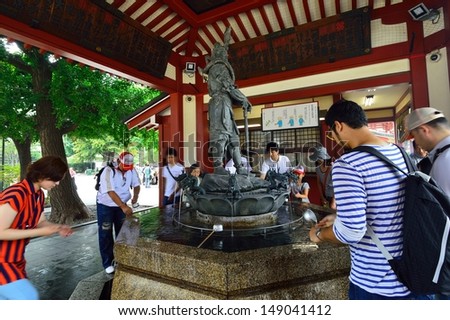 TOKYO, JAPAN - AUGUST 02: People who visit the Kannon temple in August 02 2013, located in Asakusa, also called Sensoji is the oldest temple in Tokyo