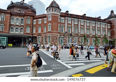 TOKYO, JAPAN - AUGUST 02: People who visit Tokyo train station in August 02 2013, one of the Largest in Tokyo that has major ports throughout Japan