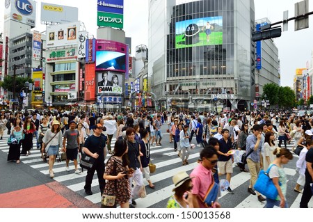 TOKYO - AUGUST 03: Crowds of people crossing the center of Shibuya in August 03 2013, the most important commercial center in Tokyo, Japan