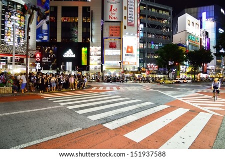 TOKYO, JAPAN - AUGUST 3: Crowds of people crossing the center of Shibuya in August 3 2013, the most important commercial center in Tokyo, Japan