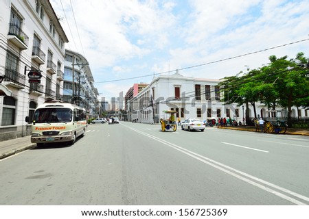 MANILA, PHILIPPINES - SEPTEMBER 8 : Car traffic on the streets of Intramuros district in September 8, 2013, oldest district and historic core of Manila, known as the Walled City