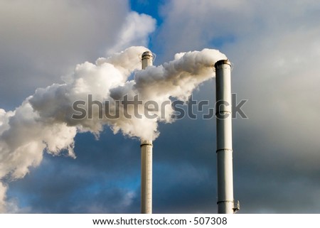 The chimney of a factory with white smoke