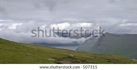 Misty clouds, mountains and water, Faroe Island