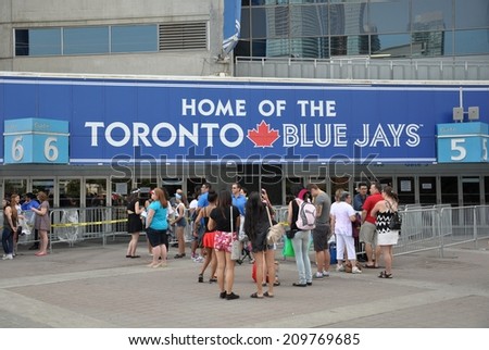 Toronto, Canada - August 3, 2014: Fans are waiting in front of Rogers Centre building, the home of Toronto Blue Jays.
