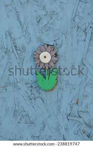 Flower made of wooden glued in a wooden wall