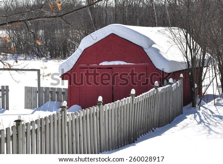 Snow covered storage area in the backyard