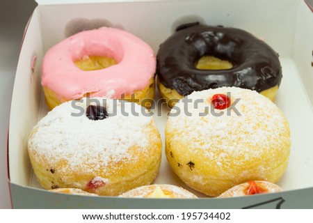 paper box of sweet donuts