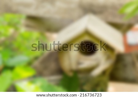 blur abstract wooden bird house in nature garden background