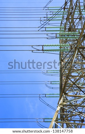 High-voltage electrical insulator electric line against the blue sky