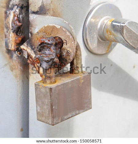 Image of a broken metal lock by welding metal and sparks