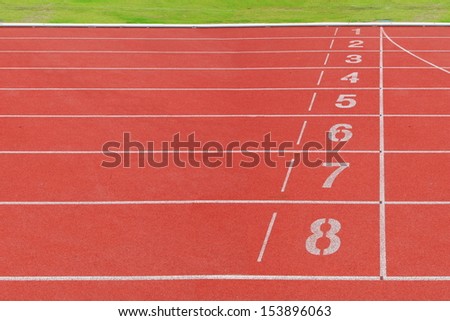Running tracks at finished position red rubber floor with white line. number 1 to 8 .