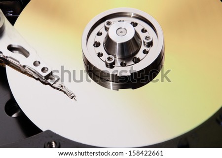 Close up of hard disk data storage cross section hardware of desktop computer PC .