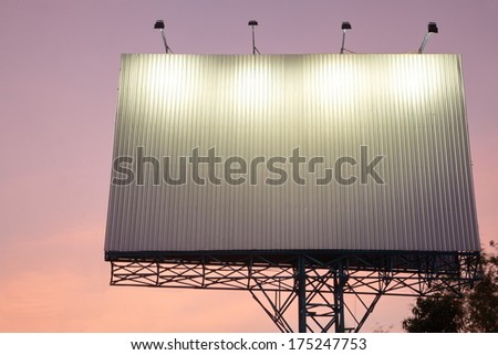 Blank White Billboard On The Edge Of Country Road Sunset Sky With Spot Light.
