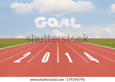 Year 2014 on running track concept with sun & blue sky. New Year, beginning, Competition and goal concept, white number on new running track with green grass and blue sky.