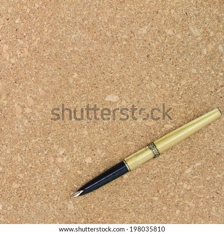 Vintage pen on cork wood