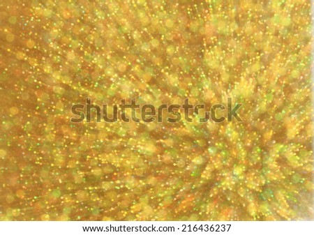 Gold abstract explosion with glitter zoom bokeh lights background.
