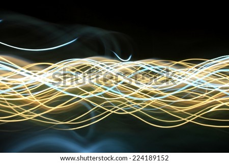 Abstract blur pattern of city moving lights from cars, streetlights and bars for background.