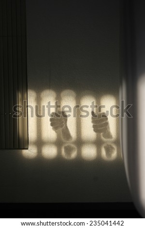 Shading both hands on the handle bars of dark leak fearful of the bedroom. artistic photo. Contrast, silhouette of hands figure on sunny day