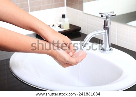 Medical wash hand cleaning with soap in the basin.