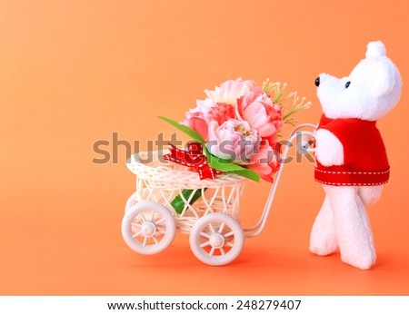 Teddy bear toy flower cart for an anniversary or Valentines celebration.