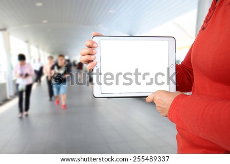 Businesswoman Using Tablet Computer in public space