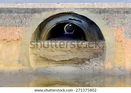 Cross section the drain closed, drains clogged with sand underground street. Visible layer of ground stones, layer of water.