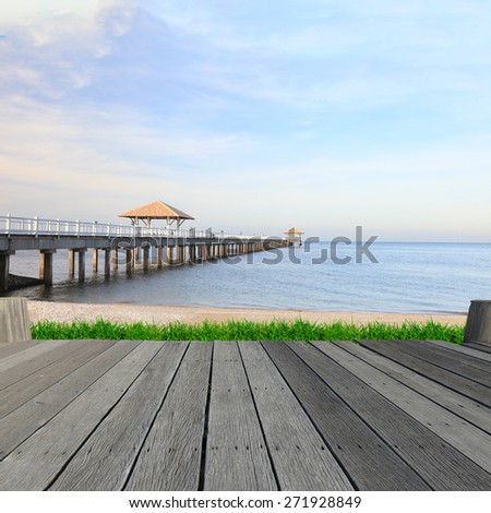 empty wooden deck table. Ready for product montage display. Boat pier at sunlight. Beautiful landscape.