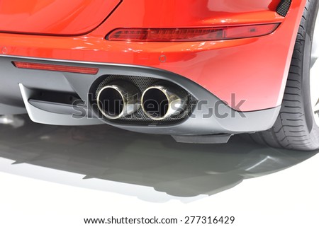 Exhaust pipe of a red car