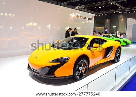 BANGKOK THAILAND - MAY 09 :  Yellow Mclaren Super car showing on exhibit space agency in Bangkok Thailand on 09 May 2015