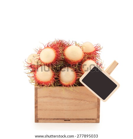 Fresh rambutans in wood box isolated on white background.This has clipping path.